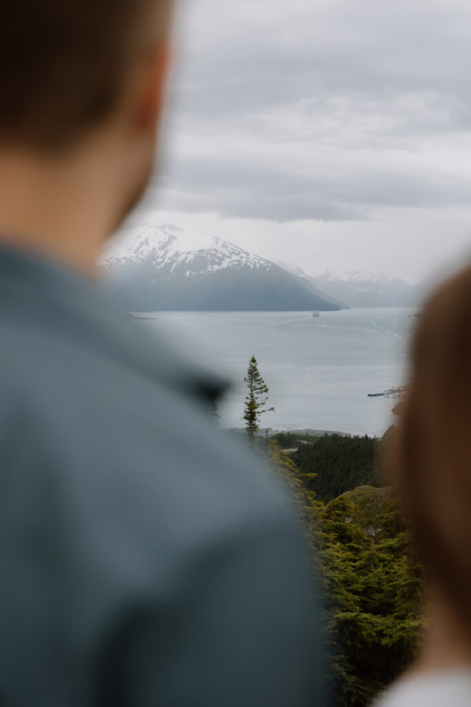 View of Prince William Sound shot between an engaged couple at Portage Pass Alaska
