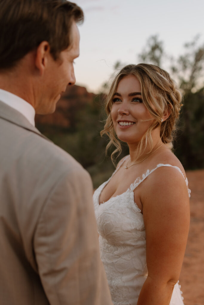 Bride smiling at groom during their Sedona Arizona elopement at Secret Slickrock