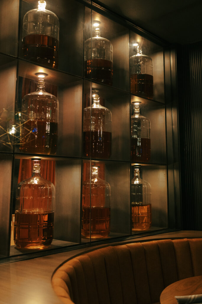 Decorative large bottles lining the wall at Broome and Orchard restaurant in Sedona Arizona