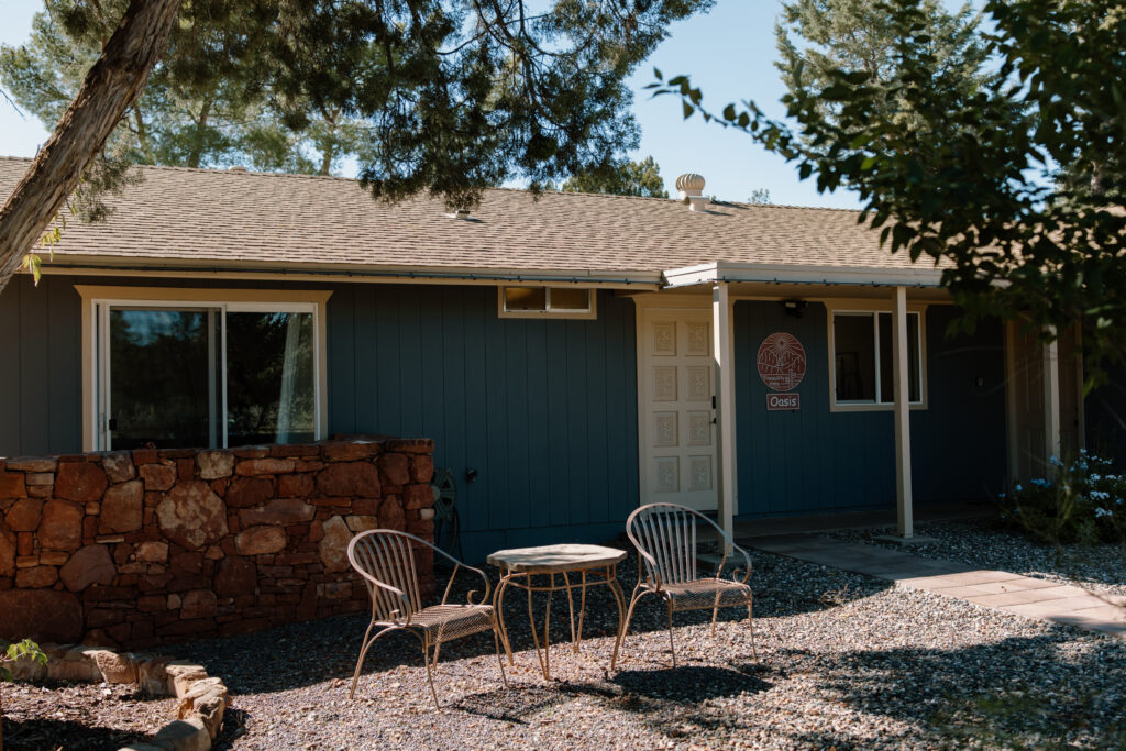 Sedona Arizona Airbnb with blue exterior and outdoor seating used as a getting ready location for a Sedona elopement