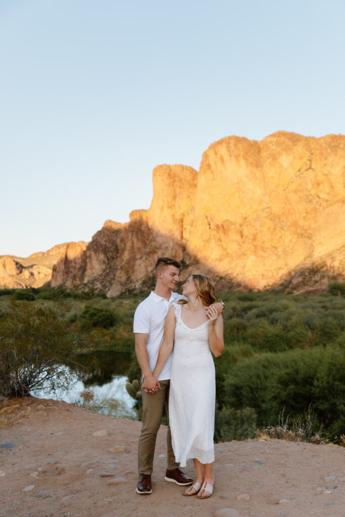 Couple embracing and looking at each other at the overlook during a Salt River photoshoot